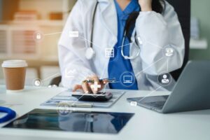 Healthcare costs and fees concept.Hand of smart doctor used a calculator for medical costs in modern hospital with VR icon diagram.